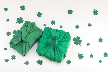 Handmade St. Patrick's Day gift concept. Furoshiki, decorative symbols, crocheted leprechaun hat