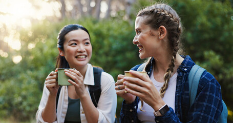 Happy, coffee and hiking with friends in nature for lunch break, trekking adventure and park conservation. Drink conversation and environment with women in forest for tea, travel and peace together