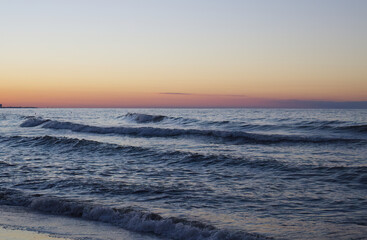 big waves at sunset, beautiful high waves at the beach, view at sea, sunset at the sea in Italy, Rimini coast, foaming goutweed, purple sky, pink and blue sky	
sandy beach