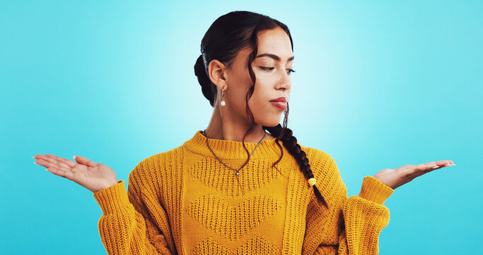 Choice, hands and woman with options, studio and comparison for decision, mockup space and gesture. Blue background, pros and weighing of cons for person, selection and girl with expression for offer