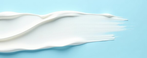 Naklejka premium Thick white cream strokes, light blue backdrop, product, cream
