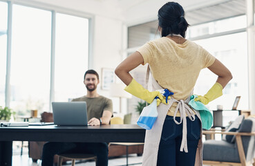 Couple, back and housekeeping with spray bottle for hygiene or cleaning at home office. Man, woman or maid with detergent, gloves or cloth for disinfection, anti bacteria or germ removal at house