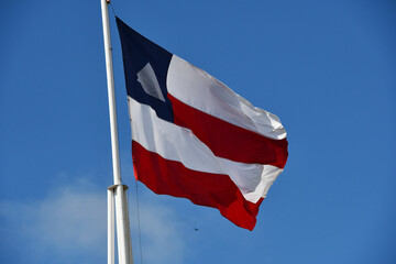 Beautiful flag of the state of Bahia on a sunny summer day with blue sky. Flag of Bahia, Brazil