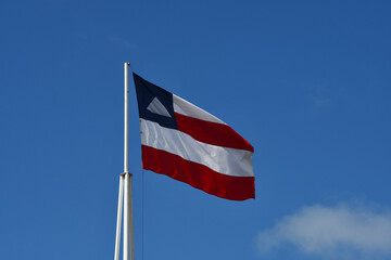 Beautiful flag of the state of Bahia on a sunny summer day with blue sky. Flag of Bahia, Brazil