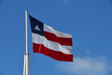 Beautiful flag of the state of Bahia on a sunny summer day with blue sky. Flag of Bahia, Brazil
