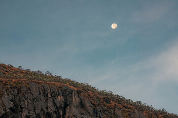 Mountainous landscape of the Colombian Andes with the moon in the background and space to copy.