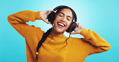 Studio, woman and singing with headphones for music, motivation playlist and sweater for fashion....