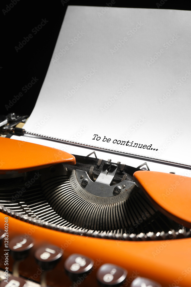 Fototapete typewriter with sheet of paper, closeup. typed text to be continued