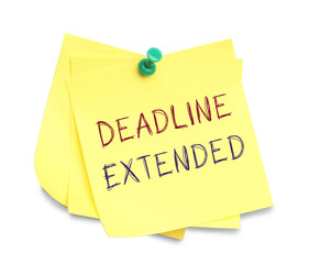 Paper note with text Deadline Extended attached to white wall