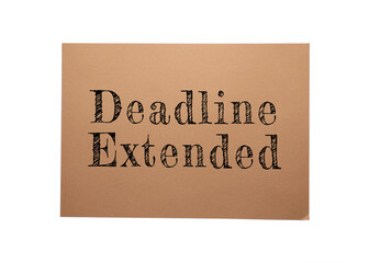 Paper note with text Deadline Extended on white background