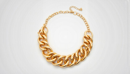 Fototapeta premium Chunky gold statement necklace on gray background, fashion accessory