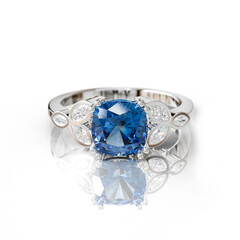 Stunning white gold ring with a deep blue sapphire, complemented by marquise and round diamonds. A regal choice for elegant jewelry lovers.
