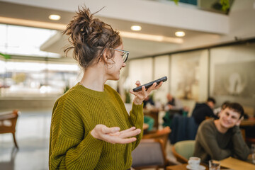 woman record voice message or use speech recognition on cellphone