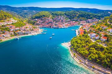A breathtaking aerial view of Pucisca on Brac Island, Croatia, showcasing its deep bay, traditional...
