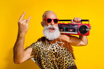Photo of funny strong cave human wear leoprad skin enjoy boom box showing hard rock sign emtpy...