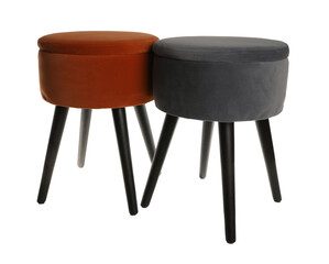 Different stylish velvet stools on white background