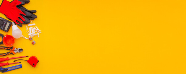 Electrical Tools and Equipment on Yellow Background