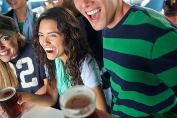 Fans, happy hour or friends in pub with beer, team or social celebration of football competition...