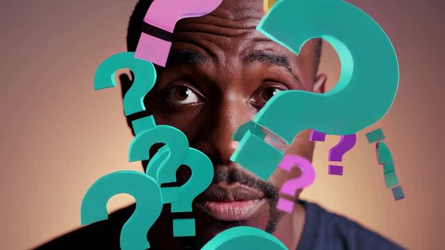 Colorful question marks float around a pensive man's head, symbolizing his deep thought process and decision making dilemma against a neutral background