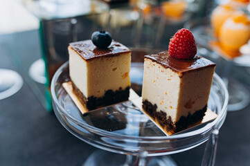 Tempting cheesecake squares topped with fresh raspberries and blueberries. Perfect treat for gatherings, celebration, or dessert lovers.