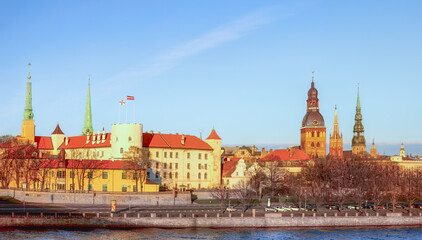 Fototapeta premium The iconic skyline of Old Riga with historic spires, rooftops, and Daugava River waterfront. City timeless beauty. For travelers ,trendy destinations , European city tours. Latvia