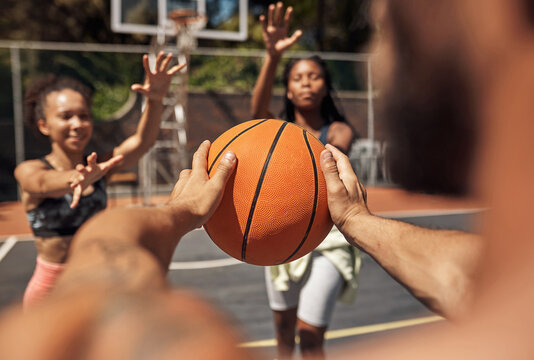 Hands, game and people on basketball court, training and wellness with fitness, technique and skills. Players, outdoor and friends with teamwork, competition and match with health and closeup