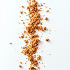 Brown sugar scattered on white surface creating sweet culinary concept