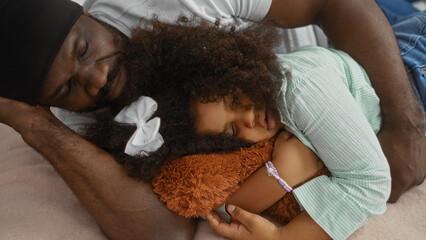 Father and daughter sharing a heartfelt moment of love and bonding on a bed in a cozy bedroom, highlighting the warmth and connection of a family together indoors.