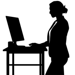 立ってパソコンで仕事をする女性のシルエット