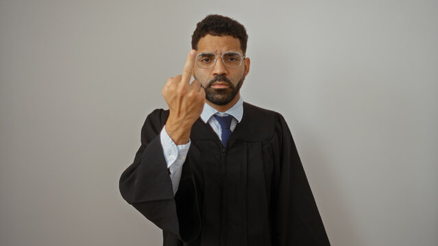 Man wearing glasses and a judge's robe shows rude gesture on isolated white background