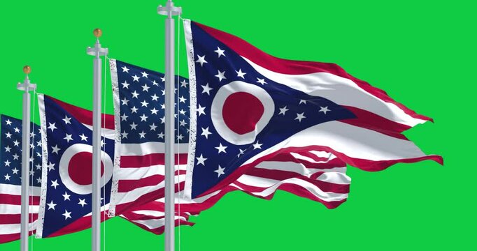 Ohio and national US flags waving in the wind isolated on green background