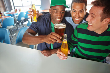 Toast, fans or excited people in pub with beer, team or social celebration of football competition and score. Happy men, soccer game event and friends hug in bar for fun party, alcohol and support