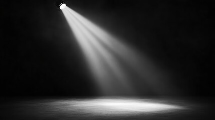 Spotlight beam on dark floor.
