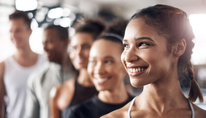 Obraz premium Thinking, happy and woman with friends in gym for fitness, exercise and training in sports club. Team, athlete and men and women for wellness, health and workout class for goals, challenge and active