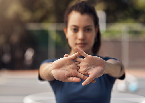 Woman, court or athlete stretching hands for fitness, sports game or preparation for workout. Ready, portrait or female basketball player in morning warm up at park for arms, exercise or training