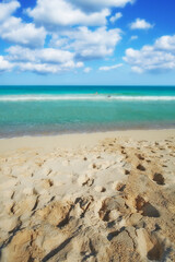 Ocean, sand and travel with view of beach for summer vacation, adventure or tropical island. Journey, waves and cloud with steps in nature for holiday destination, sea and blue sky in Hawaii