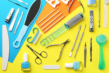 Set of pedicure tools on color background, flat lay