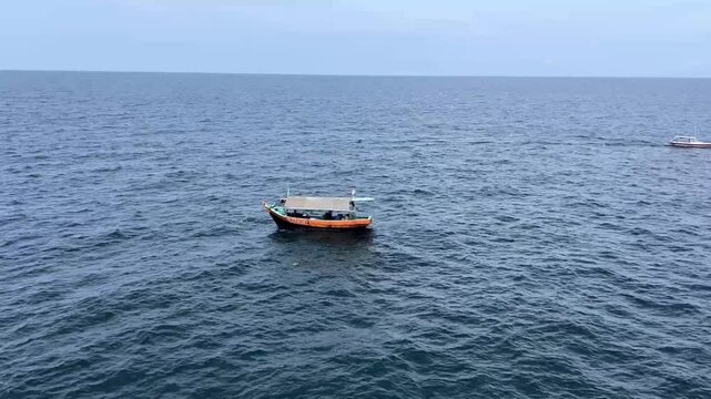View of traditional wooden fishing boats used by Indonesian fishermen to catch fish in the Java Sea of Indonesia