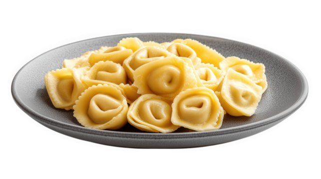 a plate filled with uncooked pasta. specifically a type of stuffed pasta resembling tortellini. arranged neatly on a gray plate the pasta is pale yellow. showcasing its smooth texture and curled shape