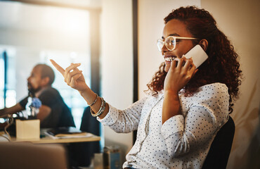 Creative, phone call and woman in office, laughing and reaction for positive feedback or...