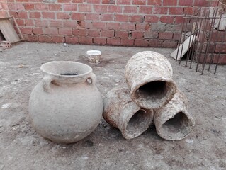 An ancient pottery water storage vessel on the roof of a house in the Egyptian countryside in Upper...