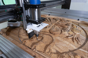 cutting a stylized teak collage on a CNC machine, a 4 mm diameter milling cutter, a ship figurine, marine animals, the final stage