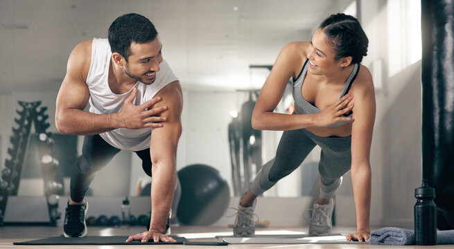 Fitness, push up and smile of couple in gym together for bonding, training or workout. Exercise, partnership or power with happy man and woman athlete in health club for challenge or performance - Powered by Adobe