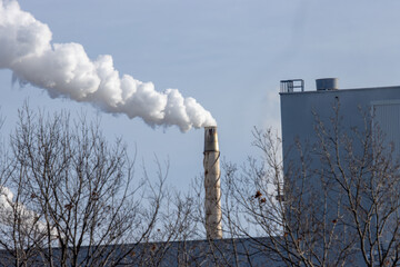 Steam flowing from an industrial exhaust stack