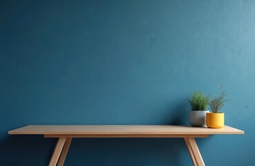 Textured blue wall with minimalist table, potted plants. Empty room scene, mockup product showcase. Promotion background with copy space for product text, design templates. Modern interior with home