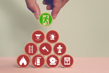 Hand choose fire door exit sing escape on wooden toy stack with for prevent and fire extinguisher...