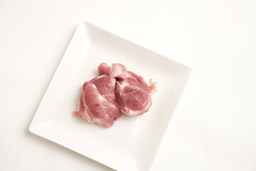 raw pork meat isolated on white background. Top view
