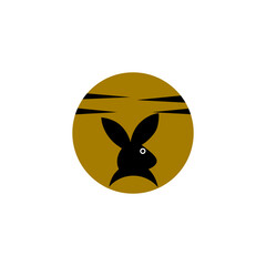 the rabbit logo is black and the circle is dark yellow