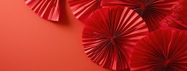 Obraz premium Elegant Red Paper Fans on Textured Background