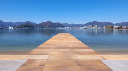 Obraz premium A serene view of a pier extending into a calm lake surrounded by beautiful mountains.